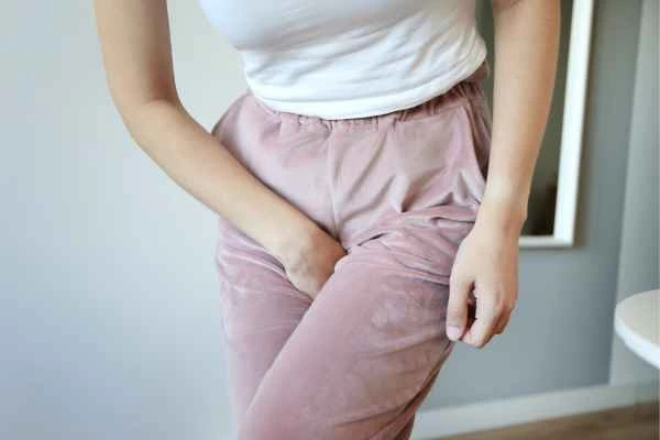 woman running for the toilet because of urinary incontinence Greater London (Haringey)